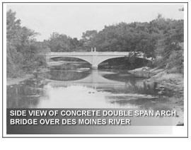 SIDE VIEW OF CONCRETE DOUBLE SPAN ARCH BRIDGE OVER DES MOINES RIVER